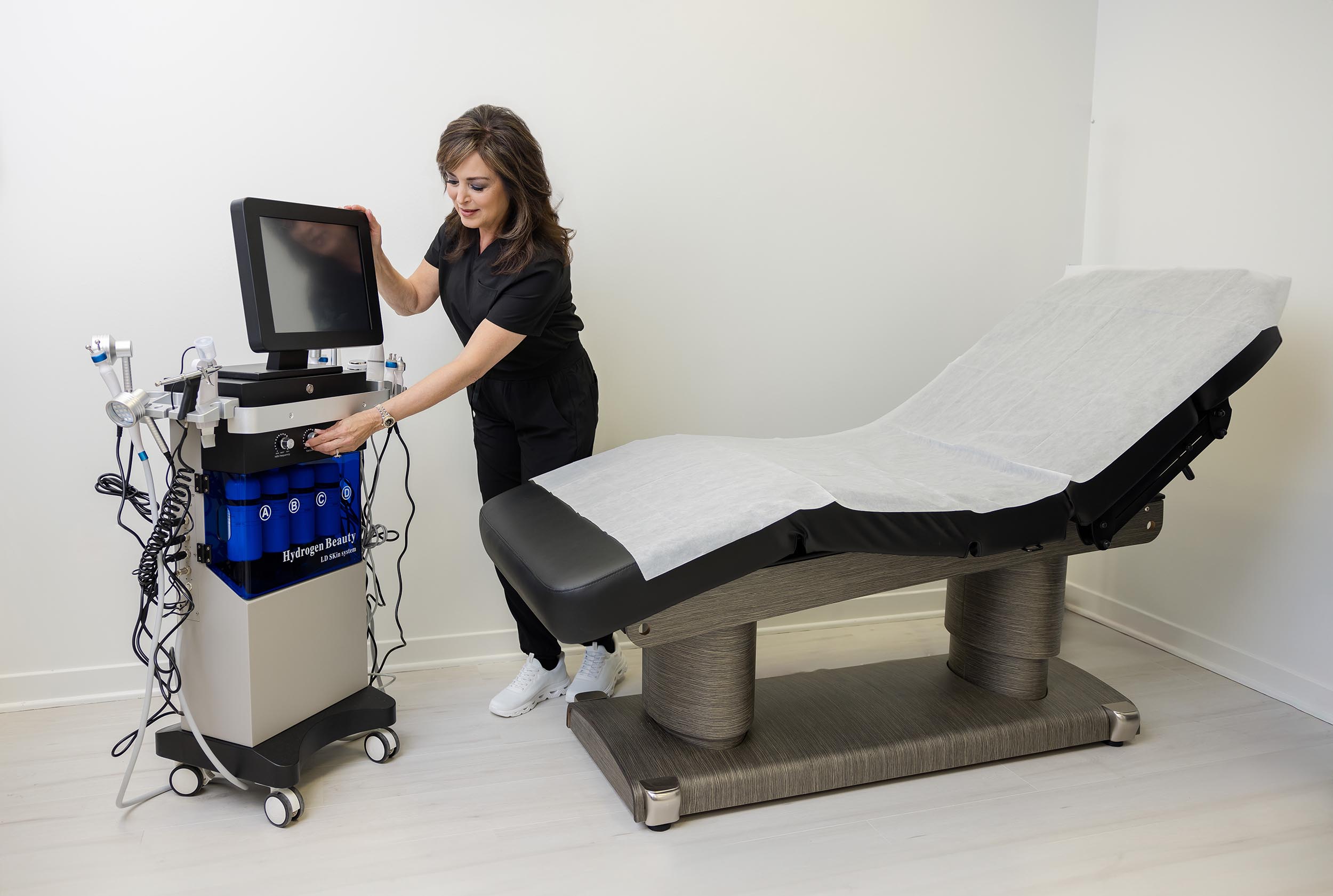 Provider preparing HIFU device for Non-Surgical Facelift with HIFU in Bartlett, IL